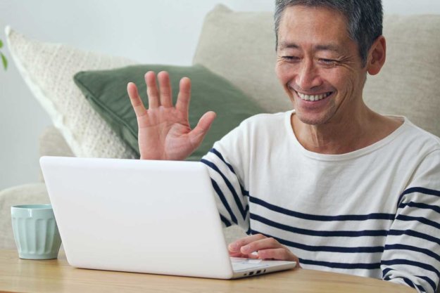 1-Staying-in-Touch-While-Staying-Home man staying connected while in senior living