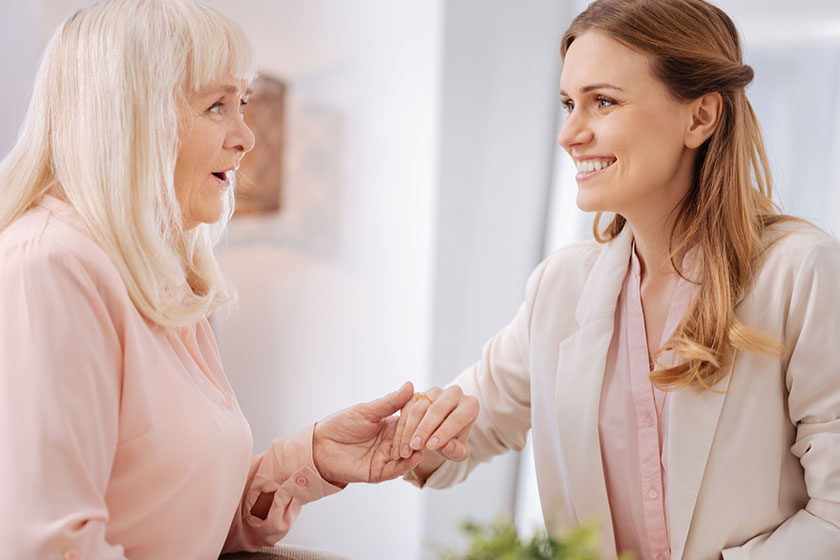 Positive senior woman being happy for her daughter Positive senior woman being happy for her daughter