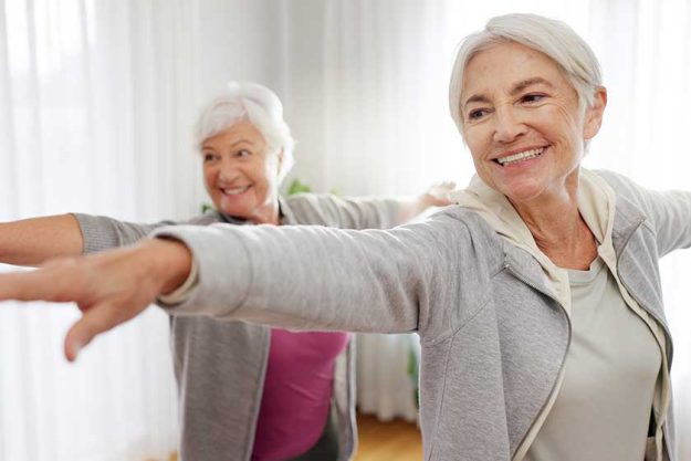 Exercise, yoga and senior woman friends in a home studio to workout for health, wellness or balance. Fitness, zen and chakra with elderly people training for mindfulness together while breathing