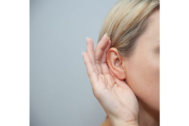 Woman with ear pain or neck pain