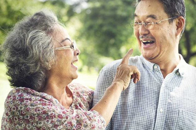 Senior Couple Relax in park Senior Couple Relax in park