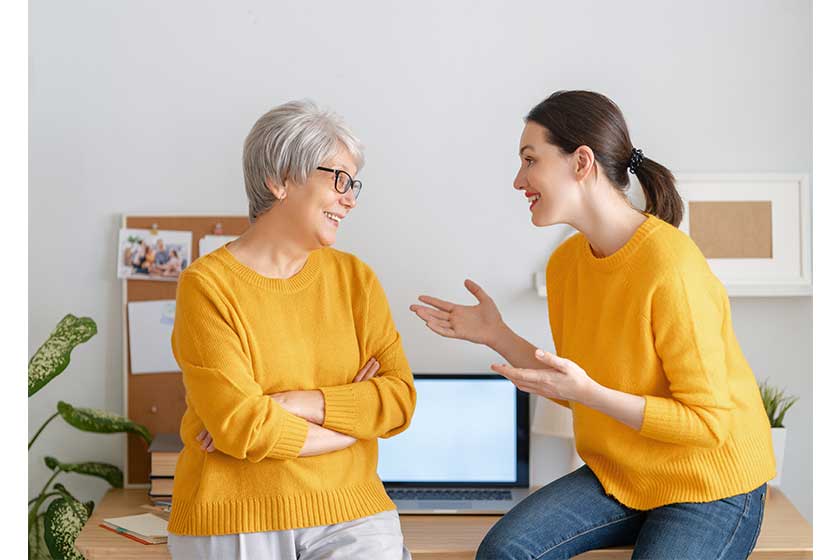 Young-and-senior-women-are-chatting-and-laughing