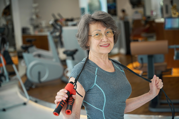 elderly-lady-performs-special-exercises-skipping-rope elderly-lady-performs-special-exercises-skipping-rope