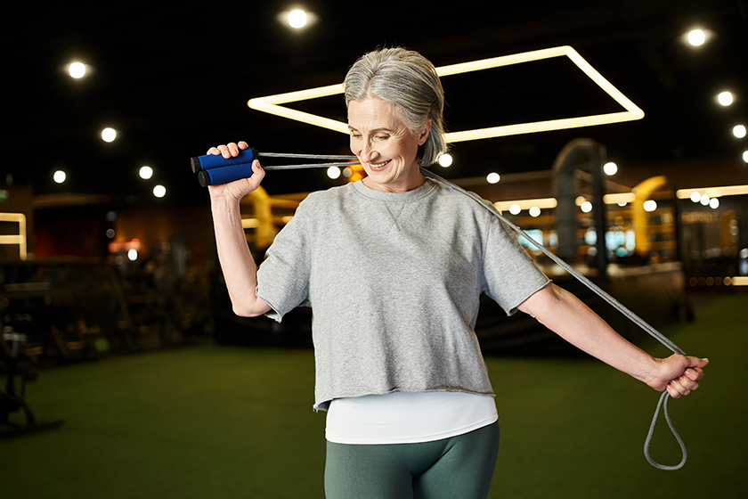 joyous-mature-beautiful-woman-sportswear-posing