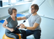young-specialist-advises-patient-gym