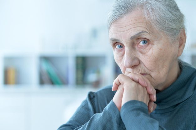 Close up portrait of sad senior woman