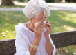 Senior woman has a runny nose