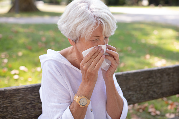senior-woman-has-runny-nose Senior woman has a runny nose