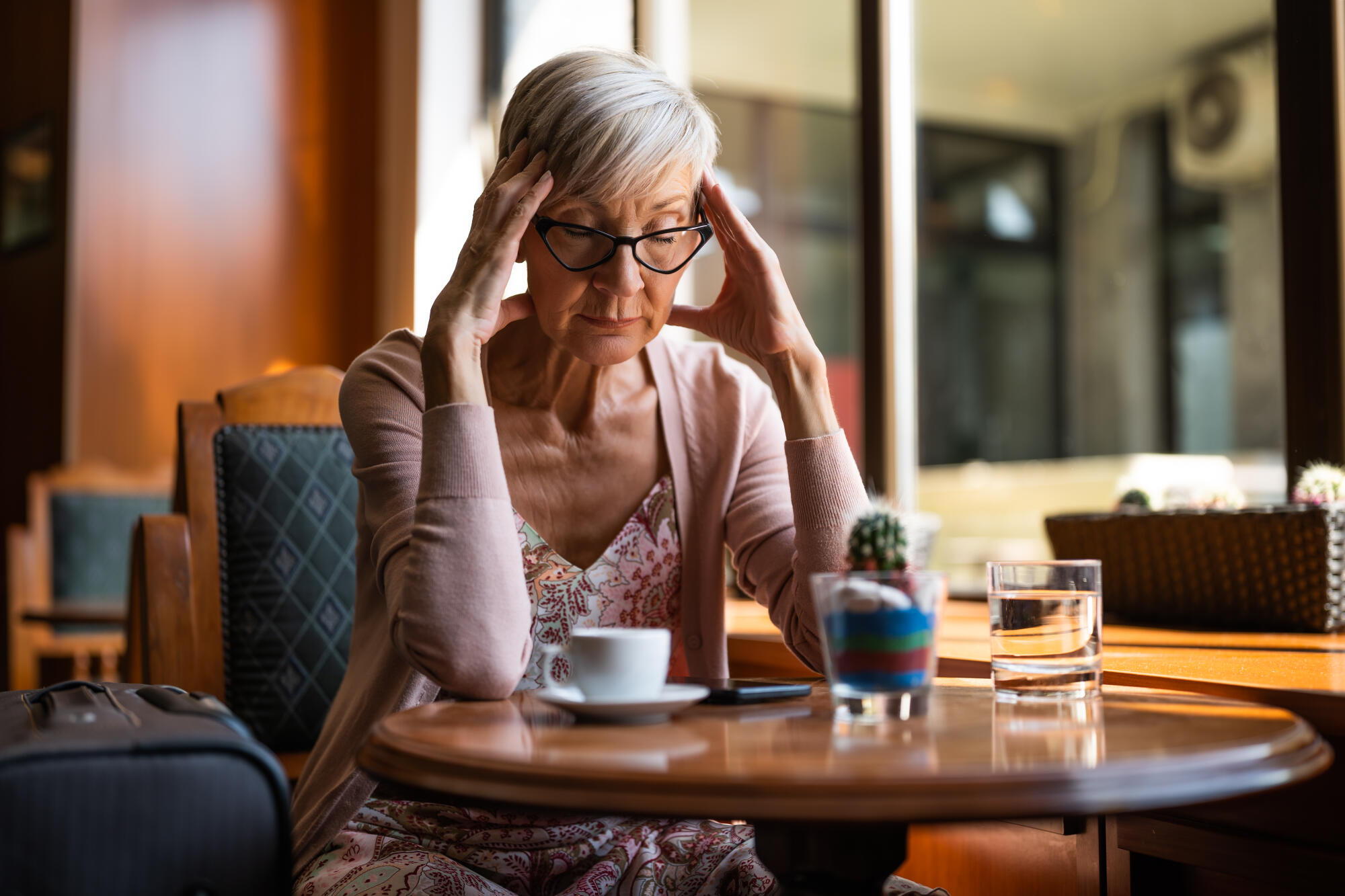 Mature-woman-is-sitting-in-a-c (1)