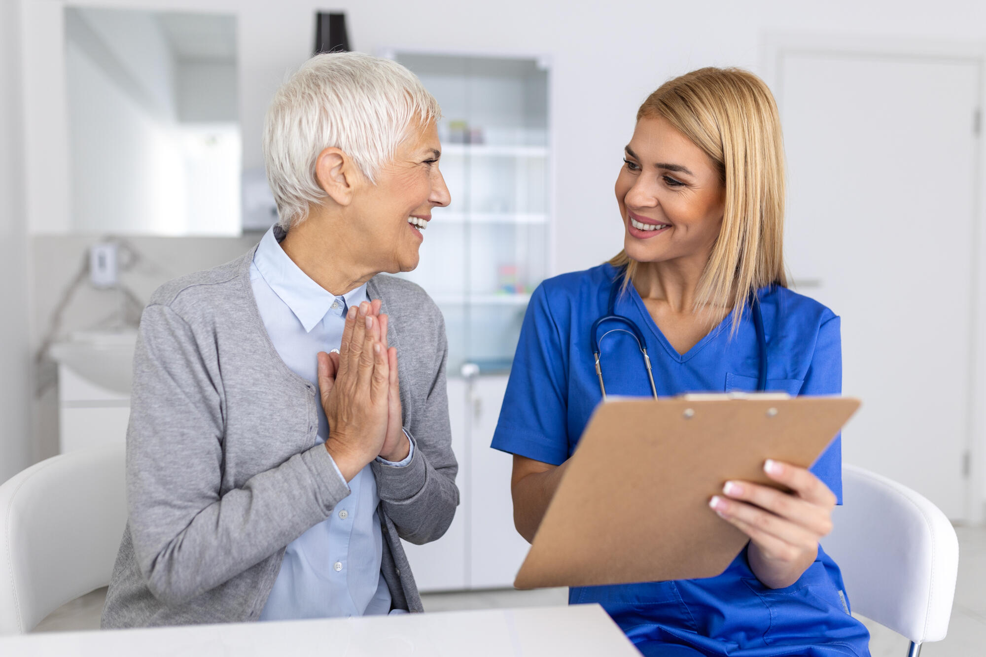 Young female professional doctor physician consulting patient, talking to senior woman client at medical checkup visit. diseases treatment. medical health care concept